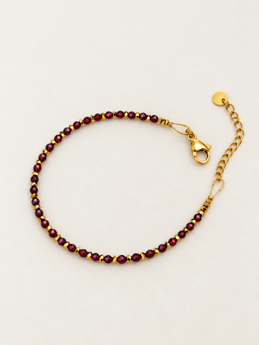 Bracelet Edouard de perles grenat et hématite dorée à l'or fin